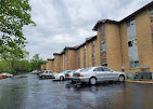 Modern apartment building exterior, representing a high-quality residential choice and access to amenities when Living in West Kansas City KS.